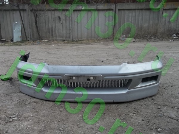 Бампер передний с губой Lancer Cedia 